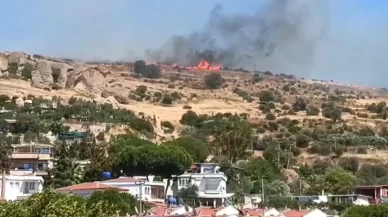 İzmir Foça'da eski çöplükte çıkan yangın makilik alana sıçradı