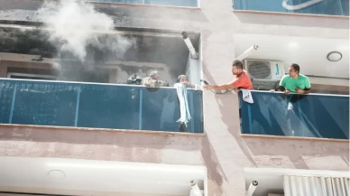 Alevlerin arasında can pazarı: İtfaiyeci maskesini çıkarıp vatandaşa taktı