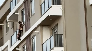 Yürekler ağızlara geldi: 7'inci katın balkonunda baş aşağı sallandı