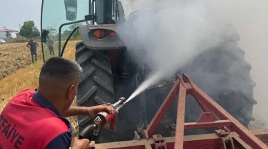 Tarlasını sürerken traktörü alev aldı
