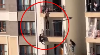 Balkondan düşmek üzere olan çocuğu tırmanarak kurtardı