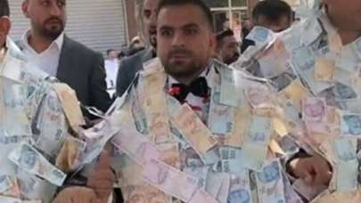 Damat paraların içinde resmen kayboldu!