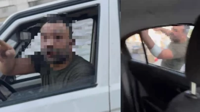 Trafikte tartıştığı kadınların otomobilini yumrukladı