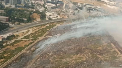İzmir'de makilik ve otluk alanda yangına havadan ve karadan müdahale