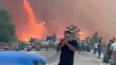 Alevler göğe ulaştı o aldırış etmeden sigarasını yaktı...